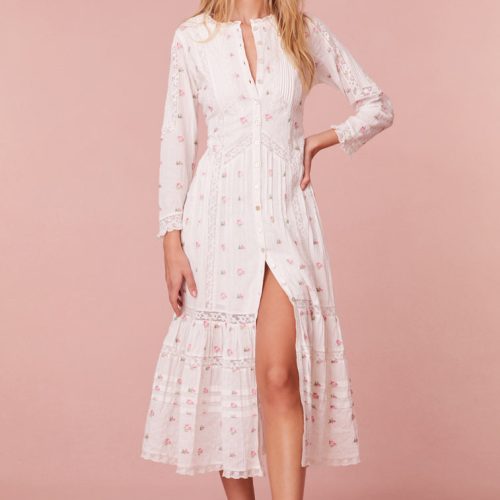 Midi dress embroidered with small pink roses. Completely button down, it begins with three quarter length sleeves before descending to the bodice with pintucking and laces all over.