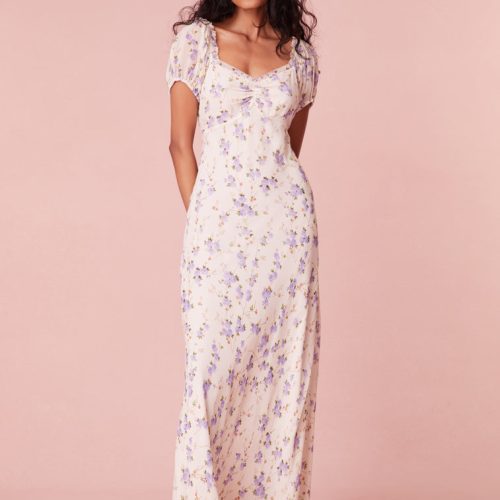 Floral printed maxi dress with short puff sleeves, a slightly square neckline with ruching at center front, and a breezy maxi skirt.