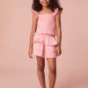 Girls top with tiny flutter sleeves, ruffle smocking all over, and a dainty ruffle peplum hem.