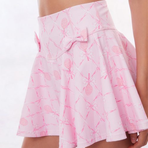 Pink active skort with a bow and tennis raquet pattern. Two pink bows placed on each frontside of hip.