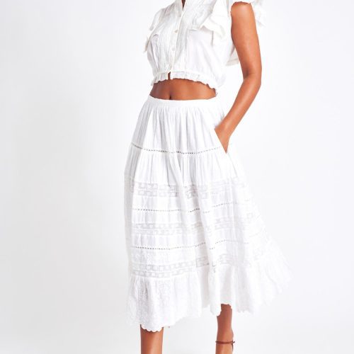 White midi skirt with lace detailing throughout the skirt as well as on the bottom trim