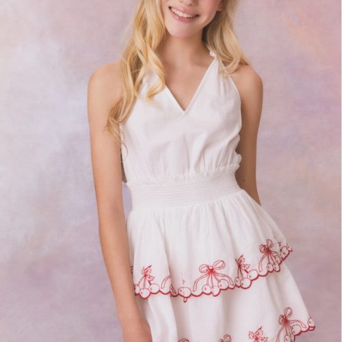 White halter v-neck dress with elastic waistband and cherry embroidery on the two tiered skirt for girls.