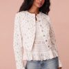 Cropped, white denim jacket featuring a pocono ikat floral print. Includes a cut-out detail on the front and custom LoveShackFancy logo buttons.