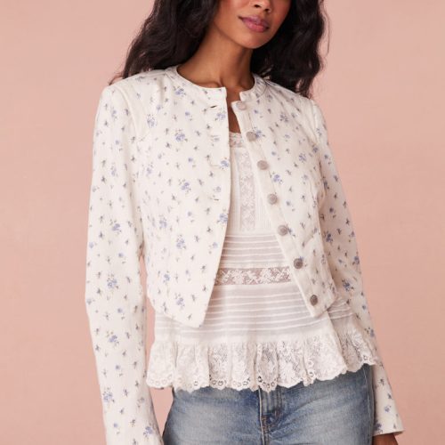 Cropped, white denim jacket featuring a pocono ikat floral print. Includes a cut-out detail on the front and custom LoveShackFancy logo buttons.