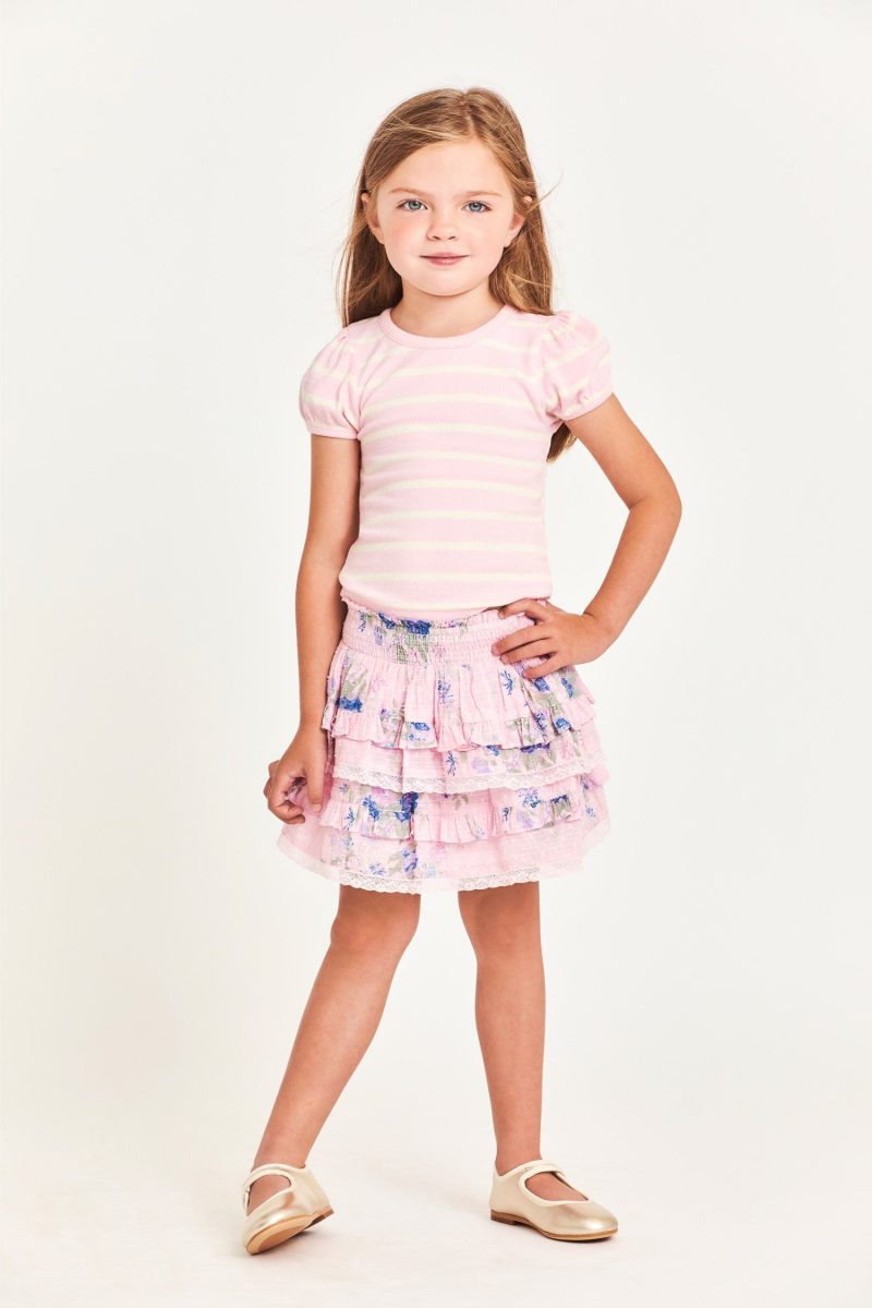 The Billie Skirt is 100% cotton and features a wide smocked waistband with two shirred tiers and ruffle detailing. It is a beautiful baby pink with blue flower detailing.