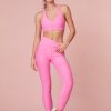 Pink high-waisted leggings with a sleek style and feature a smocked waistband for a seamless performance.