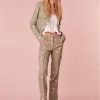 Olive green slim fit and full length pants with pink flowers embroidered all over. Includes a slit detail on the sides and cargo pockets.