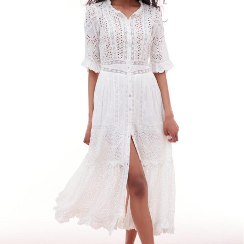 Midi dress with elbow length sleeves and a button down bodice. Features eyelet and laces above a waist yoke that descends to a sweeping skirt with pintucking details and an eyelet flounce.