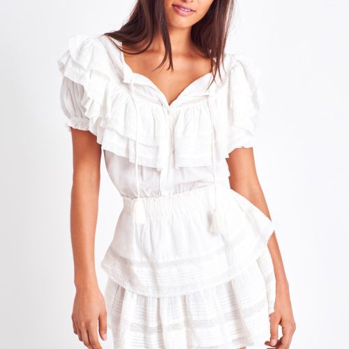 The Liv dress is a vintage inspired dress and features a puff sleeve and a double tiered yoke top. It has a ruffled mini skirt which brings in a feminine look along with front ties to finish the scoop neckline, and a cinched elastic waist.