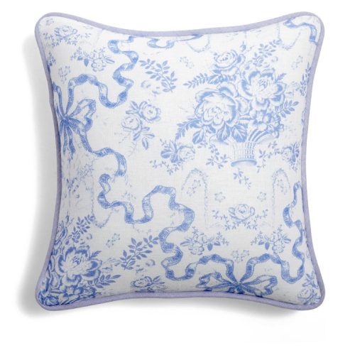 Throw pillow with a blue floral and bow print.