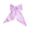 Purple floral bow clip-in.