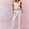 Linen straight leg cargo pants featuring pockets on each leg and on the side, and a center front zipper.