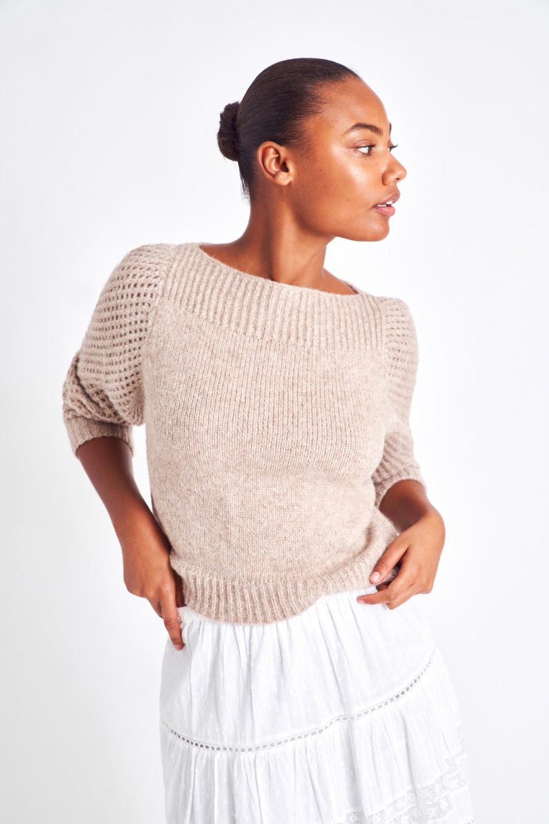 The Rosie oatmeal pullover is made from baby alpaca while being extremely light and full with a chunky look. It has a straight rib neckline and a straight body with rib finishing. It is an open knit weave with a puffy shoulder that slims out at the bottom.