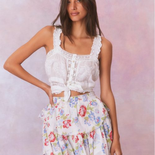 White floral tiered ruffle skirt with red, green, and blue accents with elastic waistband and double lined.