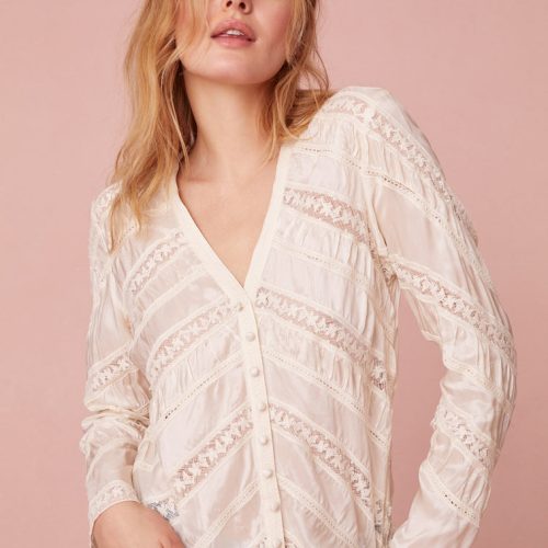 Long sleeve button down top with a v-neckline and diagonal laces for added texture detailing.