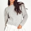 The Rosie pullover is made from baby alpaca while being extremely light and full with a chunky look. It has a straight rib neckline and a straight body with rib finishing. It is an open knit weave with a puffy shoulder that slims out at the bottom.